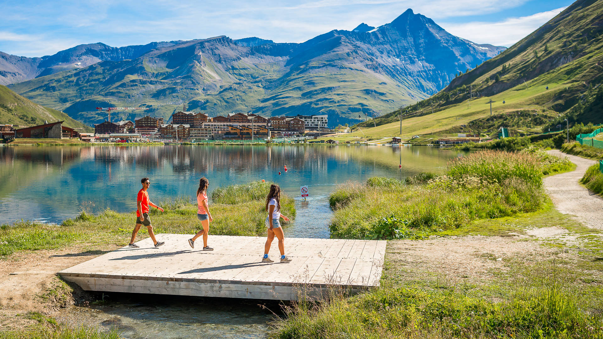 Enjoy walking around Tignes' beautiful lake